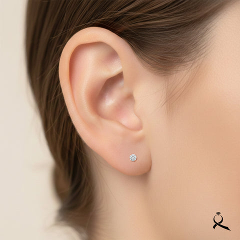 Broquel en oro 10K con circonia